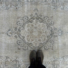 1970s beige vintage turkish rug with neutral design, hand-knotted weave and low pile.