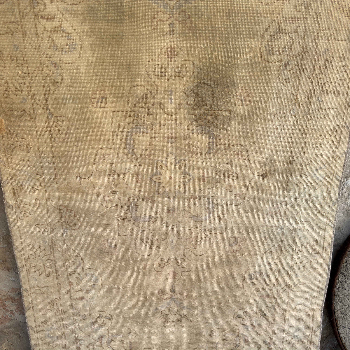 Beige 4' x 7' vintage turkish rug in wool and cotton, shown on the floor.