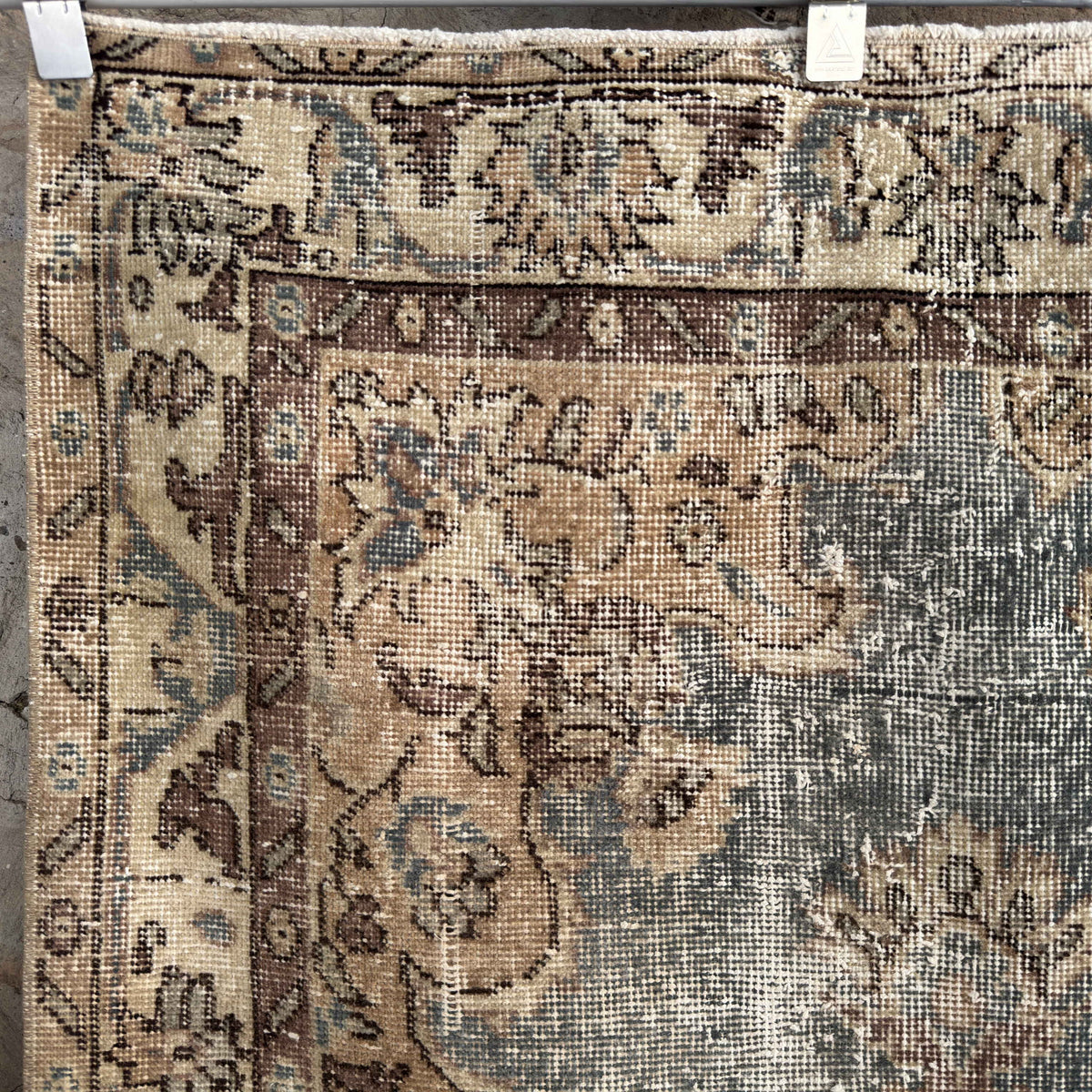 1970s blue vintage turkish rug with traditional design, hand-knotted weave and low pile.