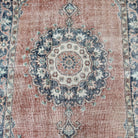 1970s blue vintage turkish rug with medallion design, hand-knotted weave and low pile.