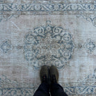 1970s blue vintage turkish rug with medallion design, hand-knotted weave and low pile.