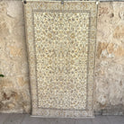 Brown 4' x 7' vintage turkish rug with floral design, handmade in Turkey – Channing.