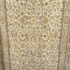 Brown 4' x 7' vintage turkish rug in wool and cotton, shown on the floor.