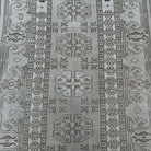 1970s gray vintage turkish rug with neutral design, hand-knotted weave and low pile.