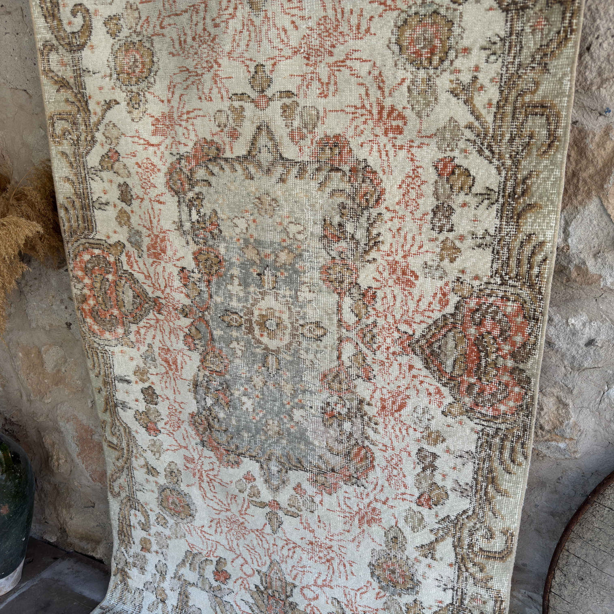Green 4' x 7' vintage turkish rug in wool and cotton, shown on the floor.