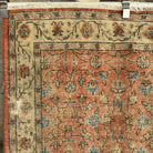 1970s orange vintage turkish rug with floral design, hand-knotted weave and low pile.