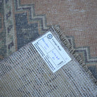 Orange 4' x 7' vintage turkish rug from the 1970s with traditional design.