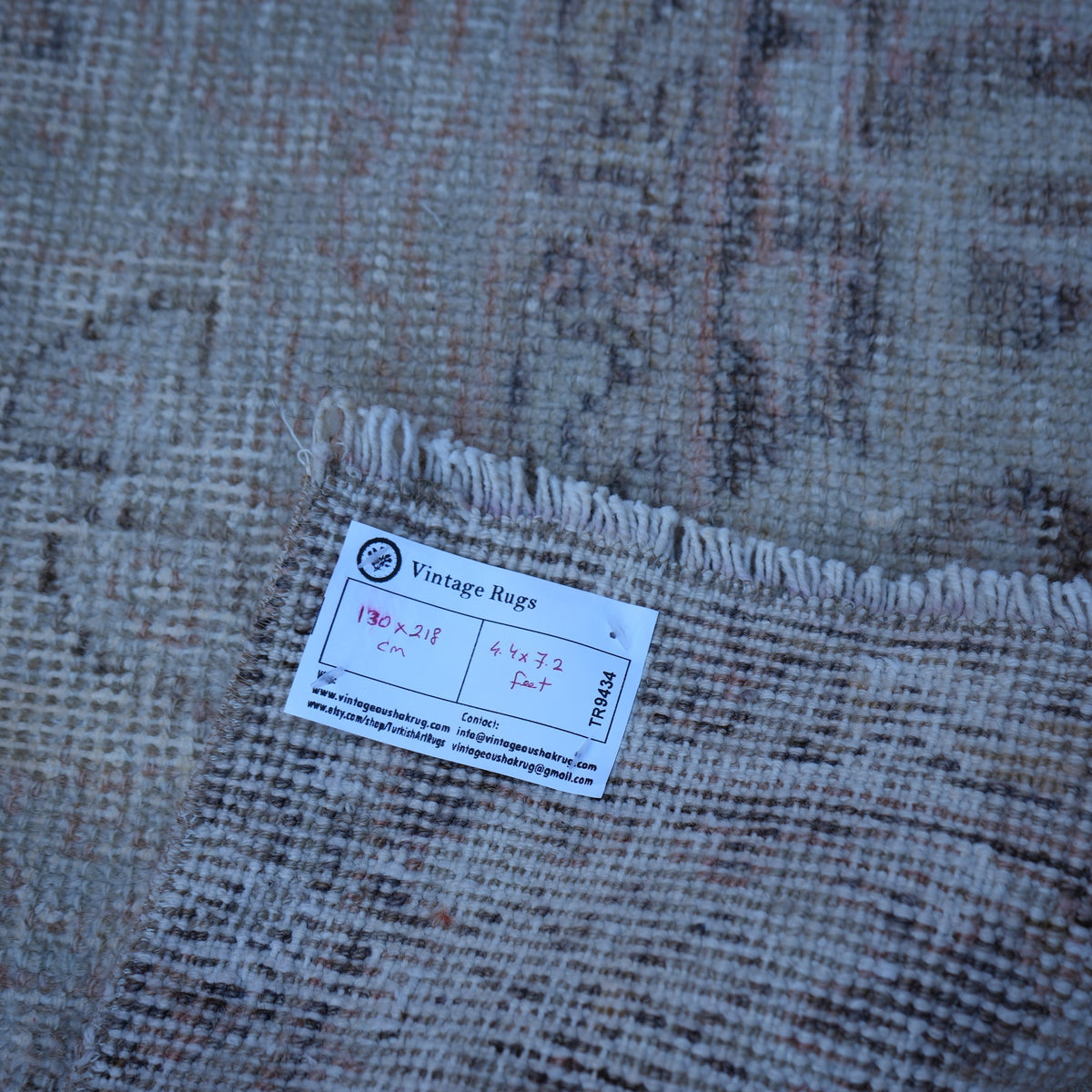 Pale Orange 4' x 7' vintage turkish rug from the 1970s with neutral design.