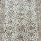 1970s pale pink vintage turkish rug with floral design, hand-knotted weave and low pile.