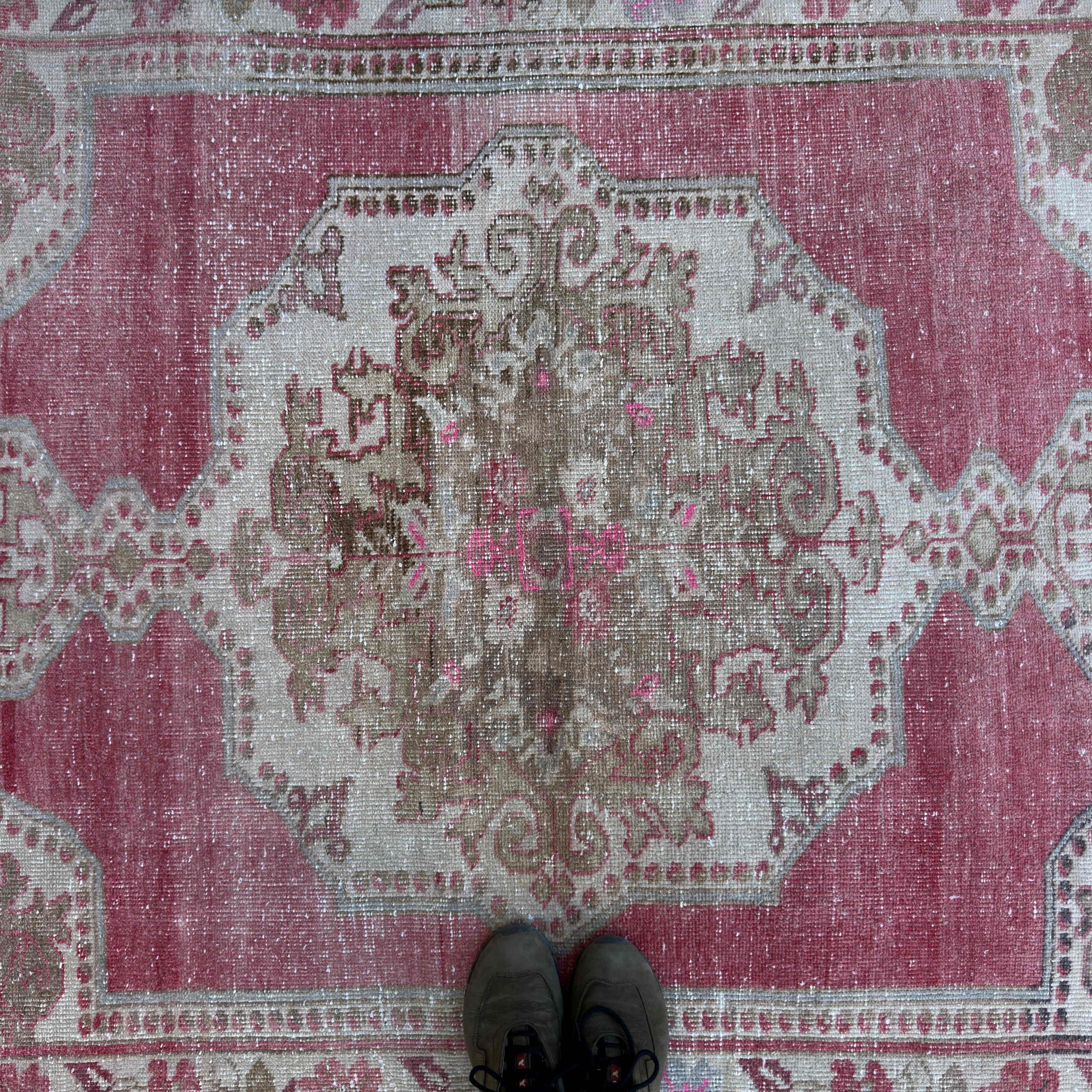 1970s pale red vintage turkish rug with traditional design, hand-knotted weave and low pile.