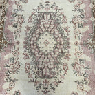 1970s pink vintage turkish rug with medallion design, hand-knotted weave and low pile.