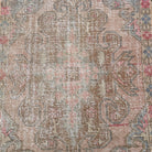 1970s pink vintage turkish rug with traditional design, hand-knotted weave and low pile.