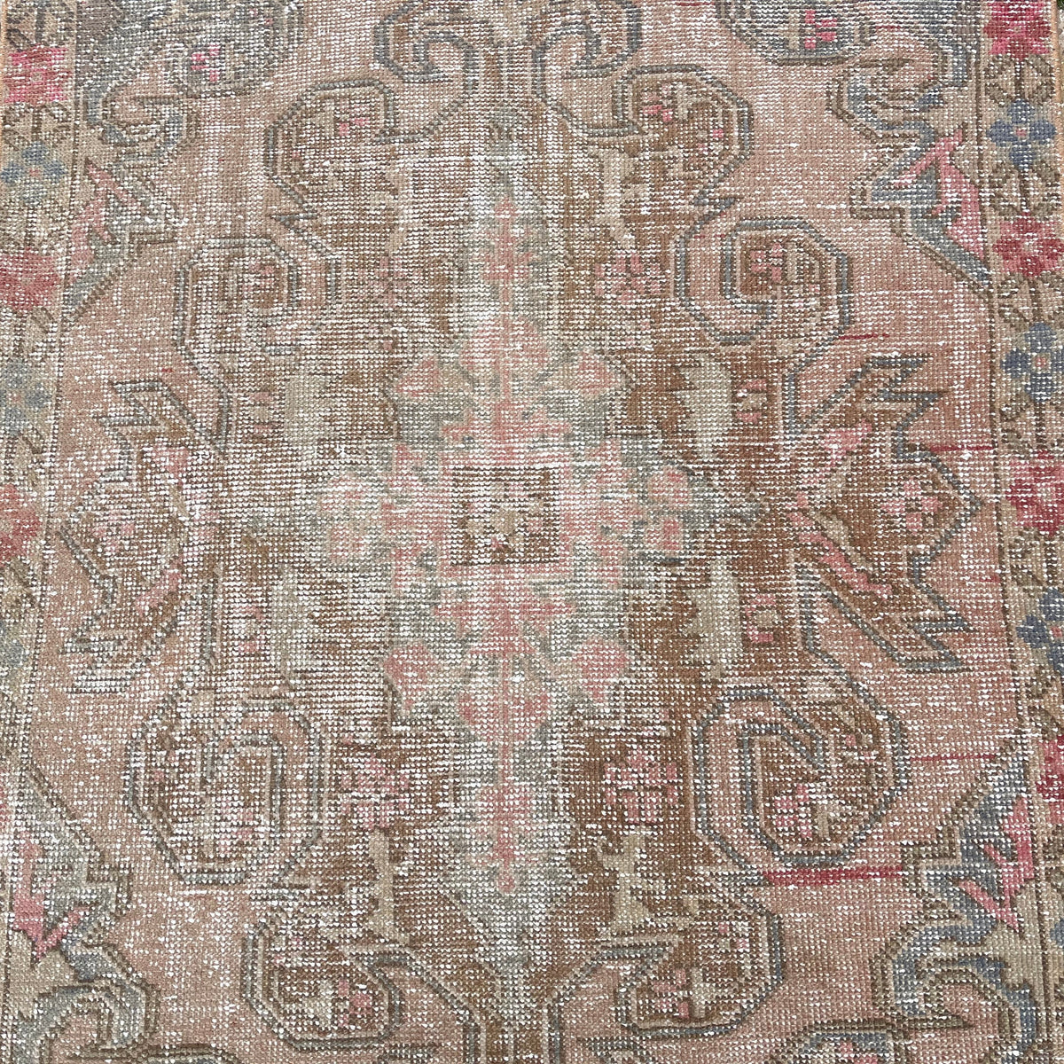 1970s pink vintage turkish rug with traditional design, hand-knotted weave and low pile.