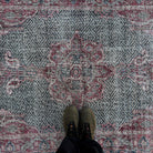 1970s red vintage turkish rug with medallion design, hand-knotted weave and low pile.