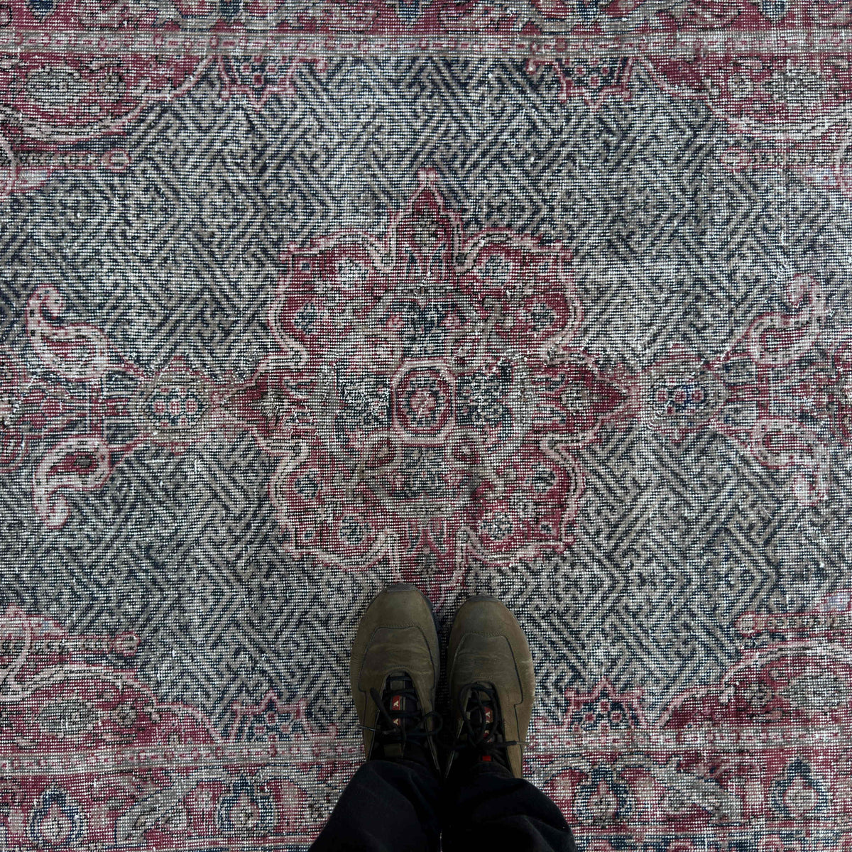 1970s red vintage turkish rug with medallion design, hand-knotted weave and low pile.