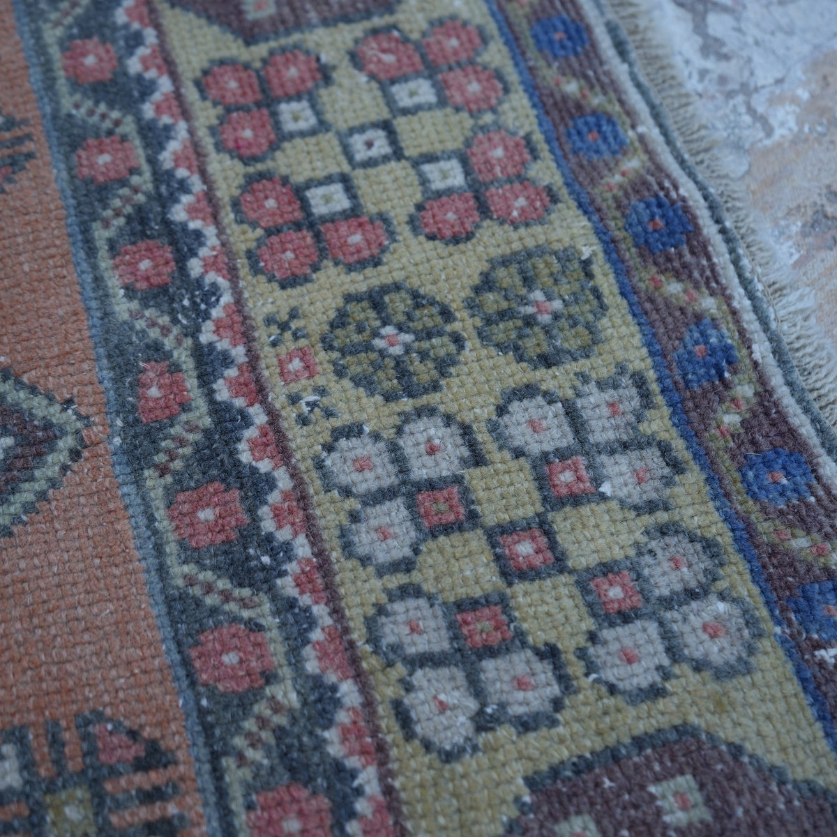 1970s red vintage turkish rug with traditional design, hand-knotted weave and low pile.