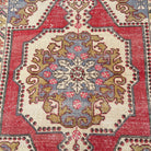 1970s red vintage turkish rug with traditional design, hand-knotted weave and low pile.