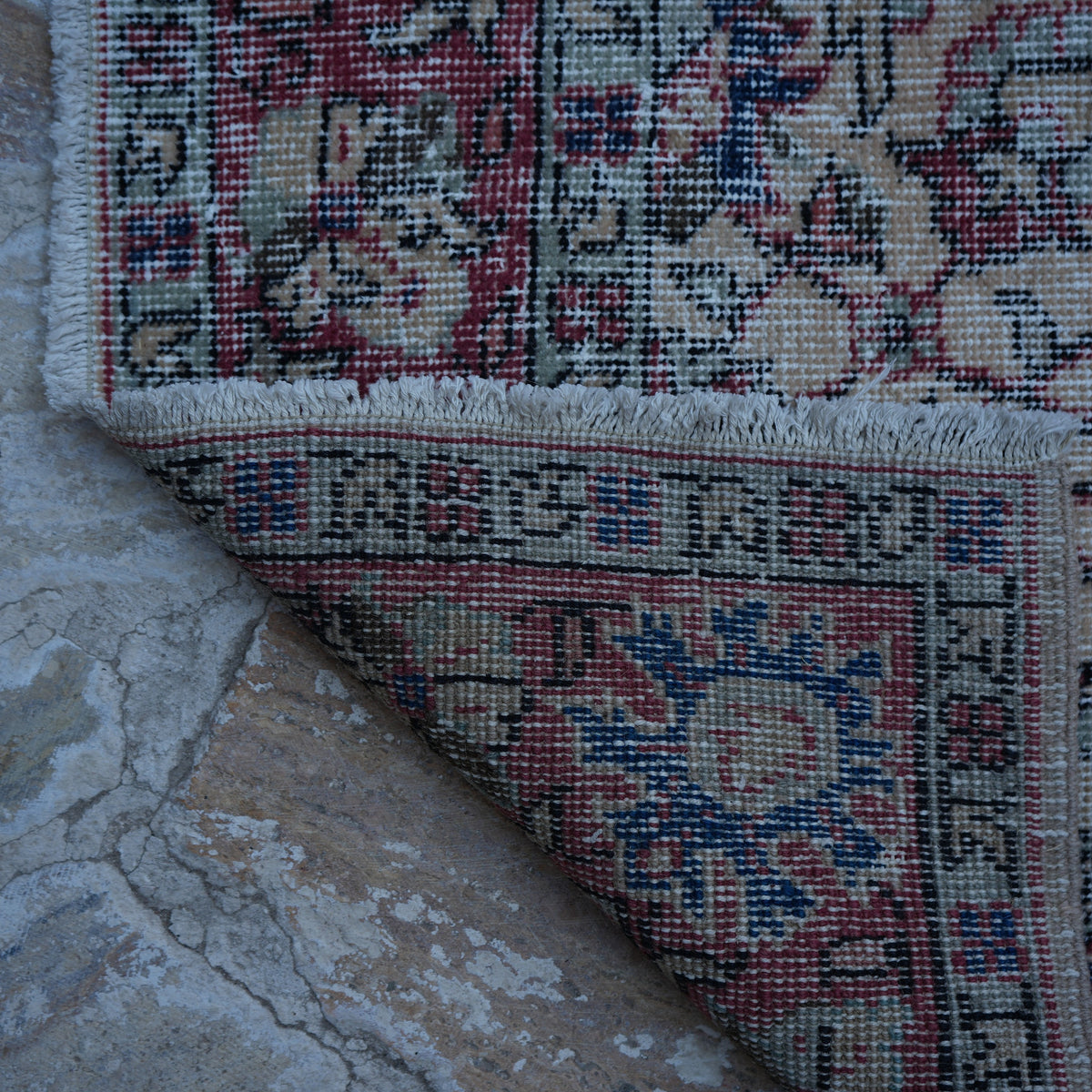 1970s red vintage turkish rug with floral design, hand-knotted weave and low pile.