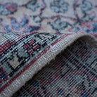 Additional view of the red vintage turkish rug, hand-knotted in wool and cotton.