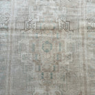 1970s beige vintage turkish rug with neutral design, hand-knotted weave and low pile.