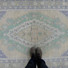 1970s beige vintage turkish rug with traditional design, hand-knotted weave and low pile.