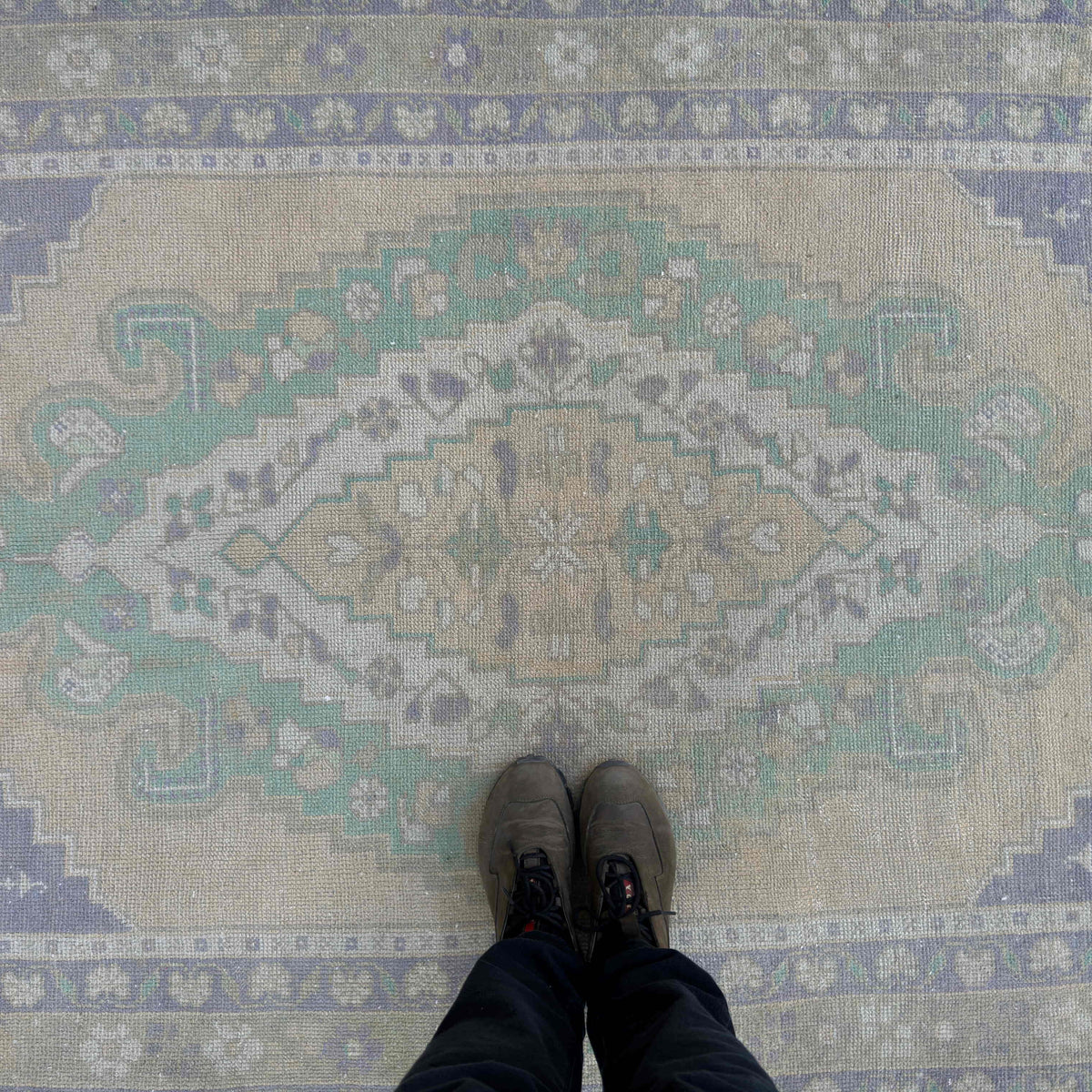 1970s beige vintage turkish rug with traditional design, hand-knotted weave and low pile.
