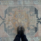 1970s beige vintage turkish rug with traditional design, hand-knotted weave and low pile.
