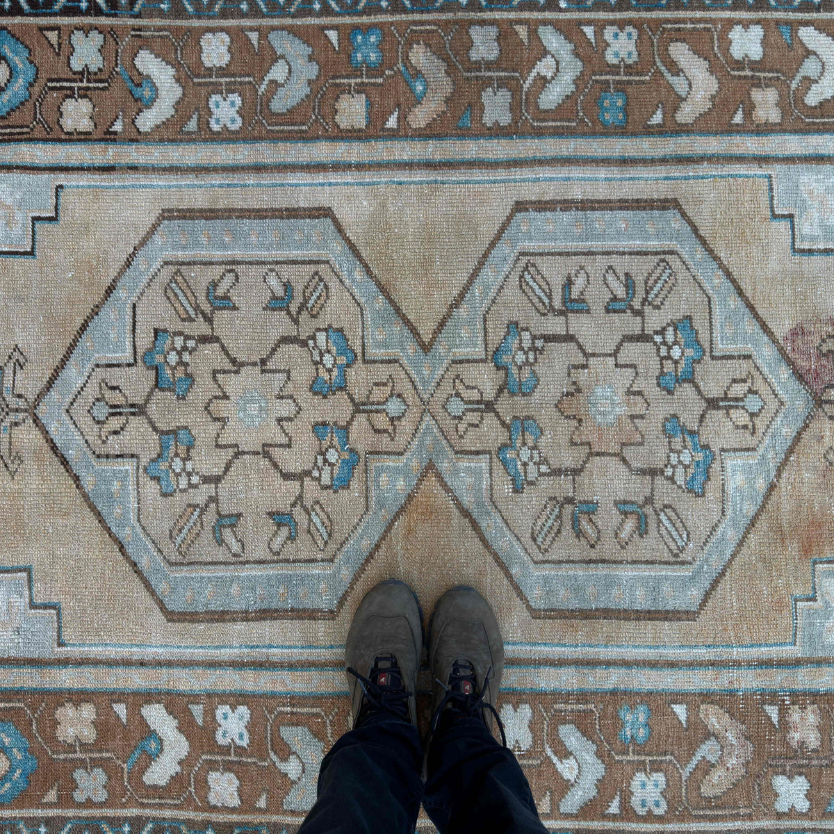 1970s brown vintage turkish rug with traditional design, hand-knotted weave and low pile.