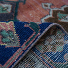 Additional view of the orange vintage turkish rug, hand-knotted in wool and cotton.