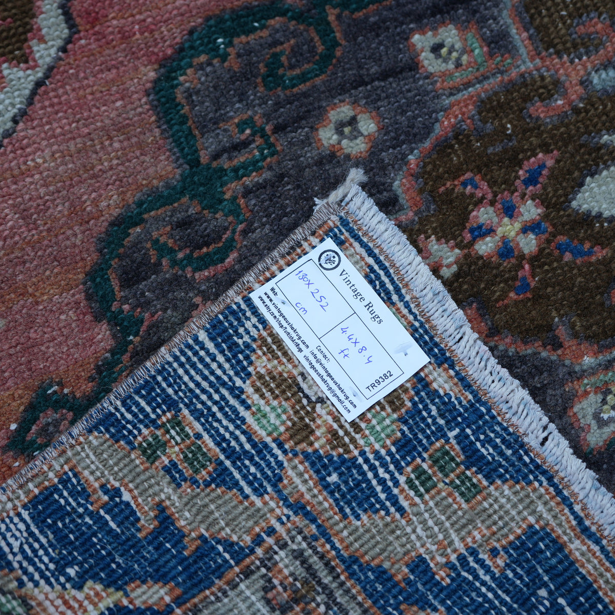 Orange 4' x 8' vintage turkish rug from the 1970s with traditional design.