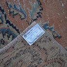 Orange 4' x 8' vintage turkish rug from the 1970s with geometric design.
