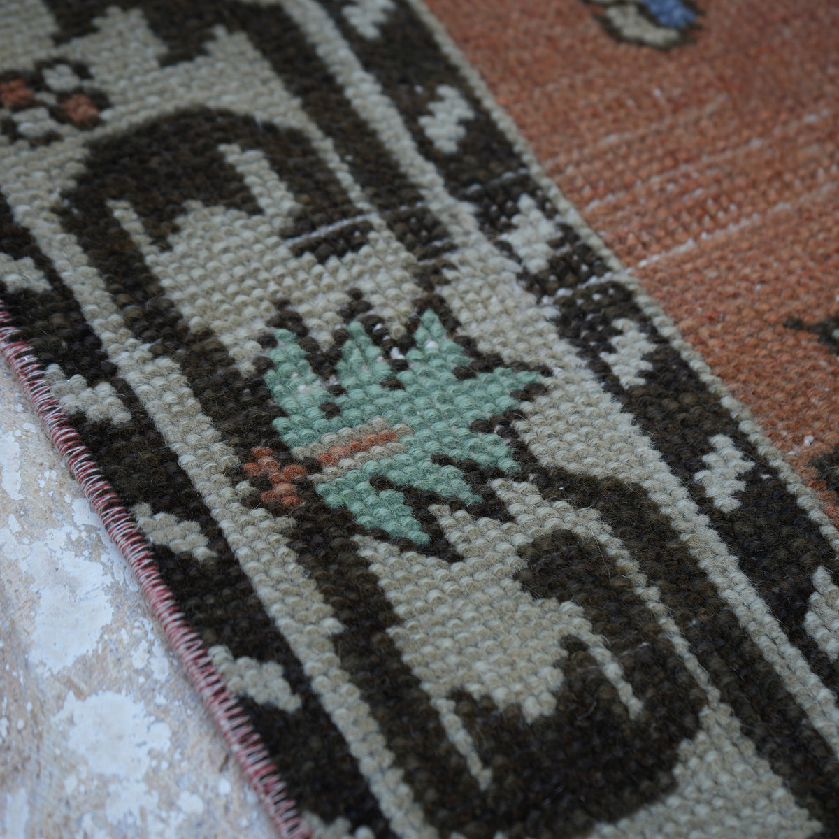 Orange 4' x 8' vintage turkish rug in wool and cotton, shown on the floor.