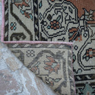 1970s orange vintage turkish rug with traditional design, hand-knotted weave and low pile.