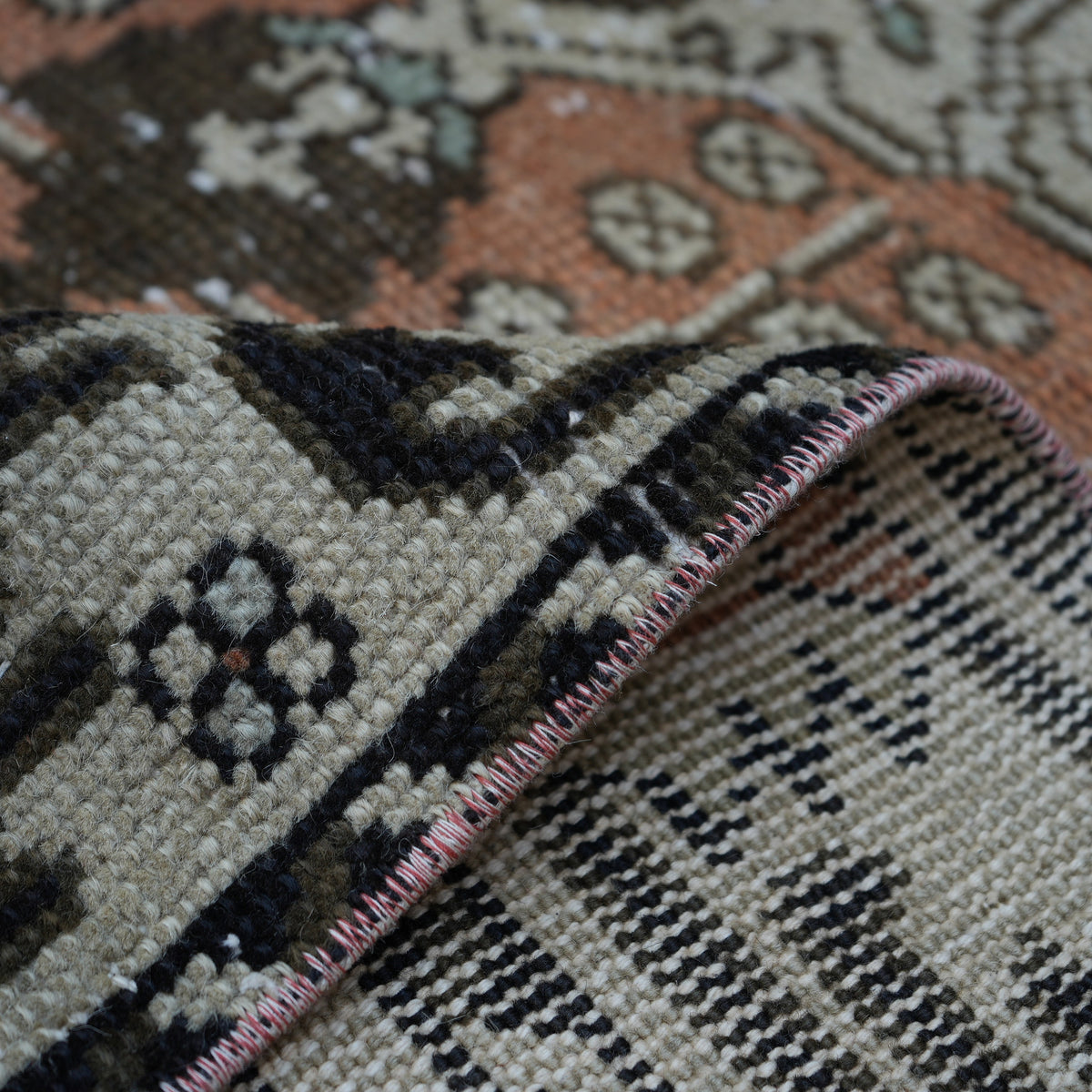 Additional view of the orange vintage turkish rug, hand-knotted in wool and cotton.