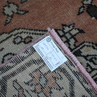 Orange 4' x 8' vintage turkish rug from the 1970s with traditional design.