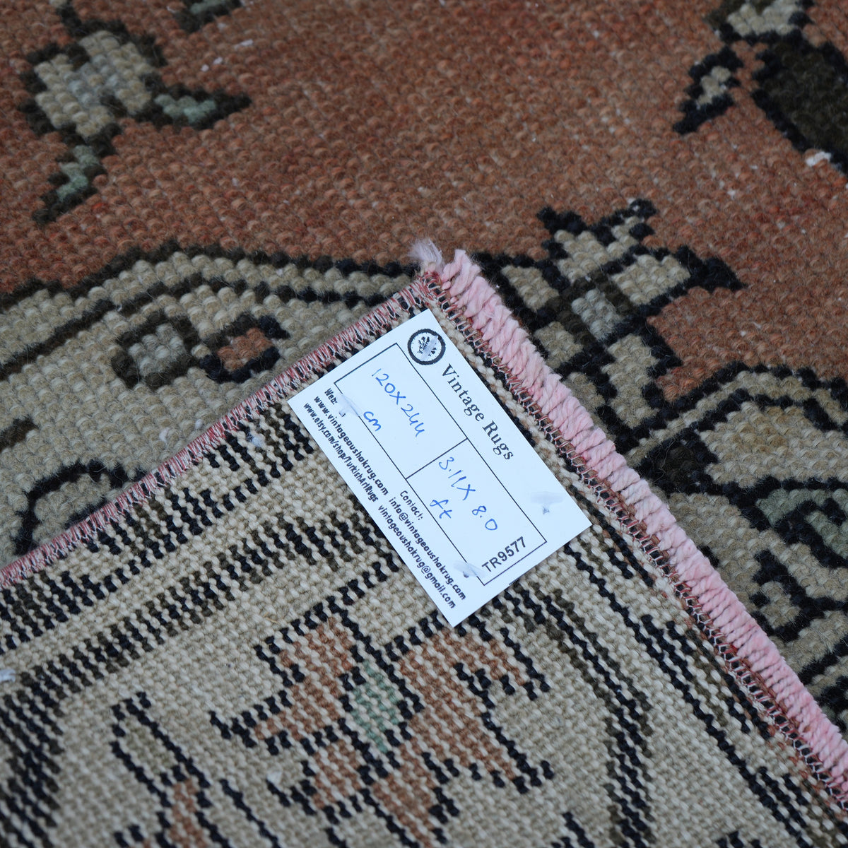 Orange 4' x 8' vintage turkish rug from the 1970s with traditional design.
