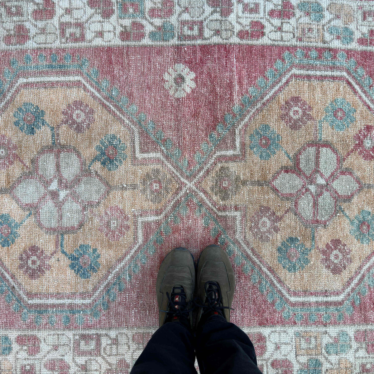 1970s pale pink vintage turkish rug with traditional design, hand-knotted weave and low pile.
