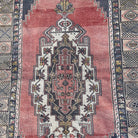 1970s pale red vintage turkish rug with traditional design, hand-knotted weave and low pile.