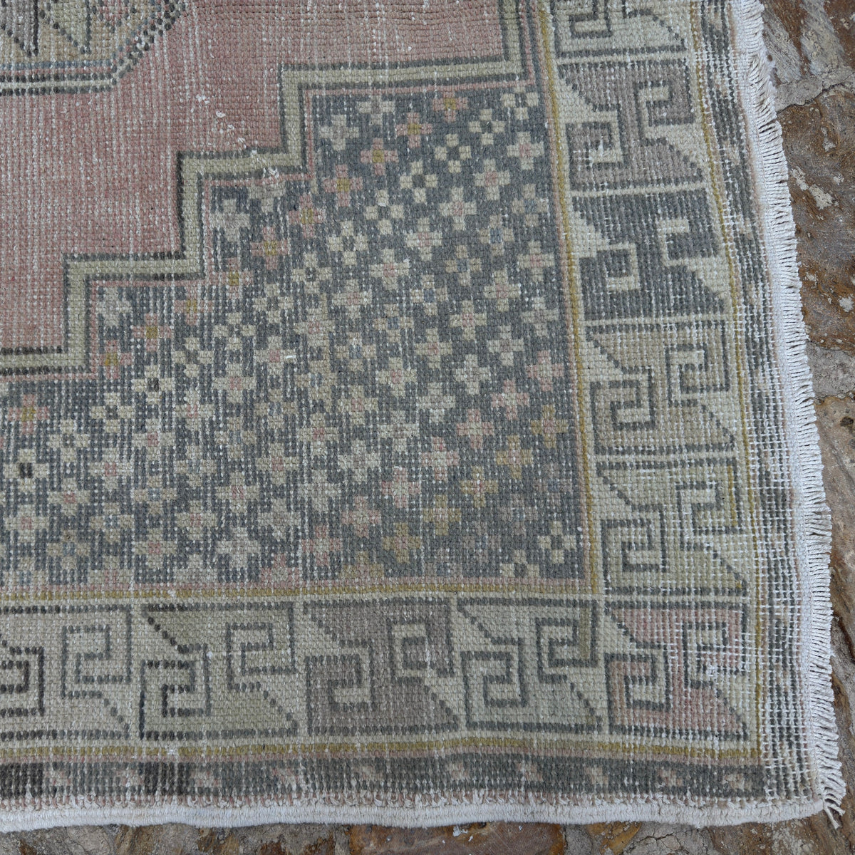1970s pink vintage turkish rug with traditional design, hand-knotted weave and low pile.
