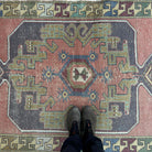 1970s pink vintage turkish rug with traditional design, hand-knotted weave and low pile.