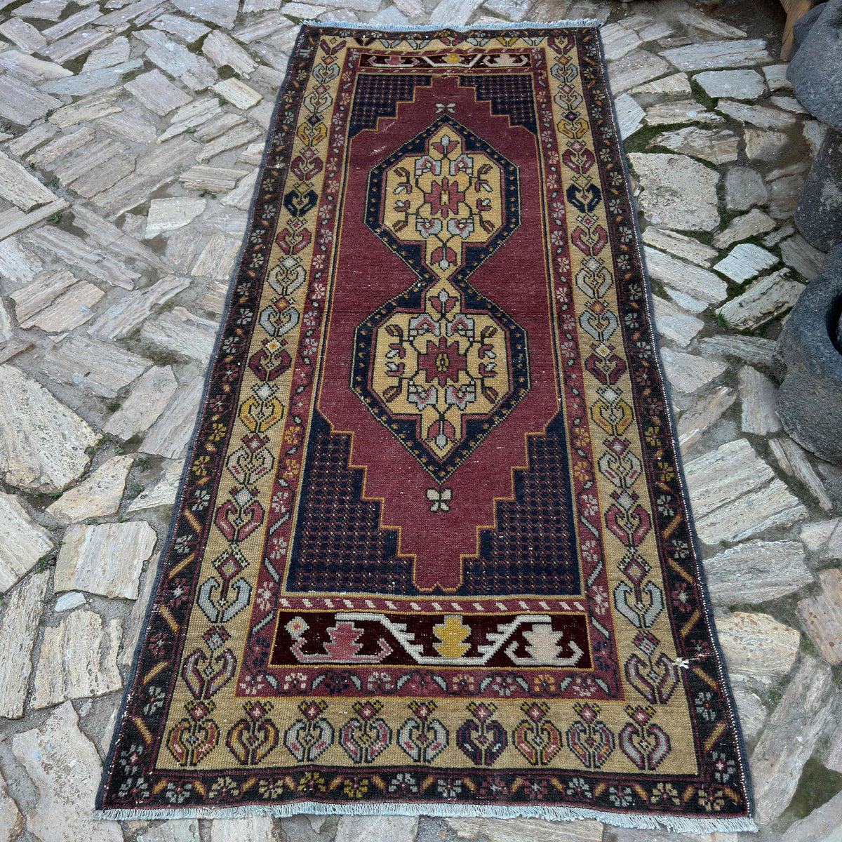 Red 4' x 8' vintage turkish rug in wool and cotton, shown on the floor.