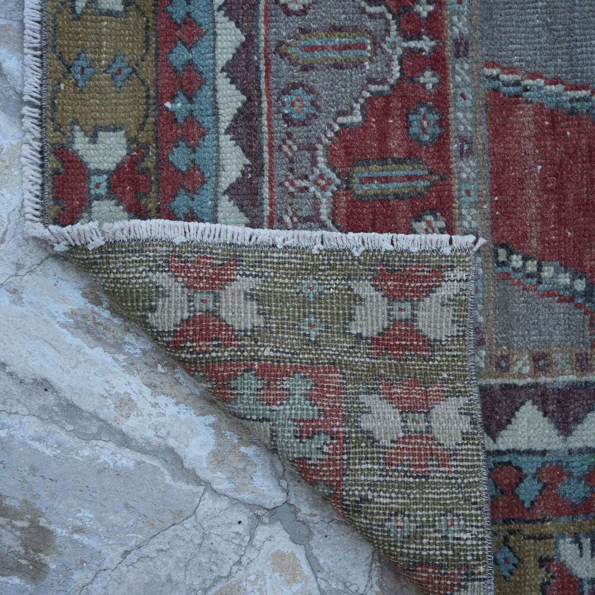 1970s red vintage turkish rug with traditional design, hand-knotted weave and low pile.