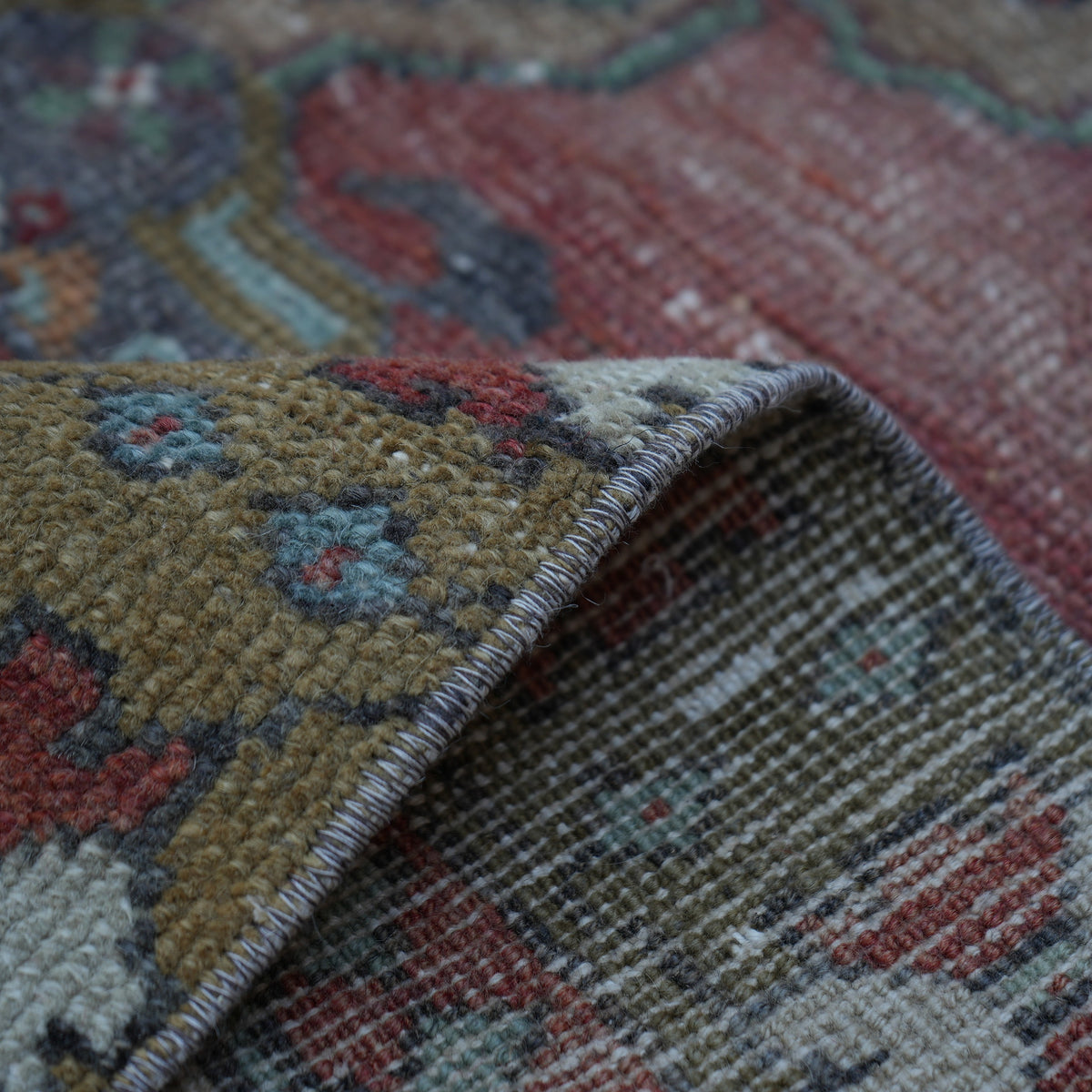 Additional view of the red vintage turkish rug, hand-knotted in wool.