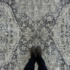1970s black vintage turkish rug with neutral design, hand-knotted weave and low pile.