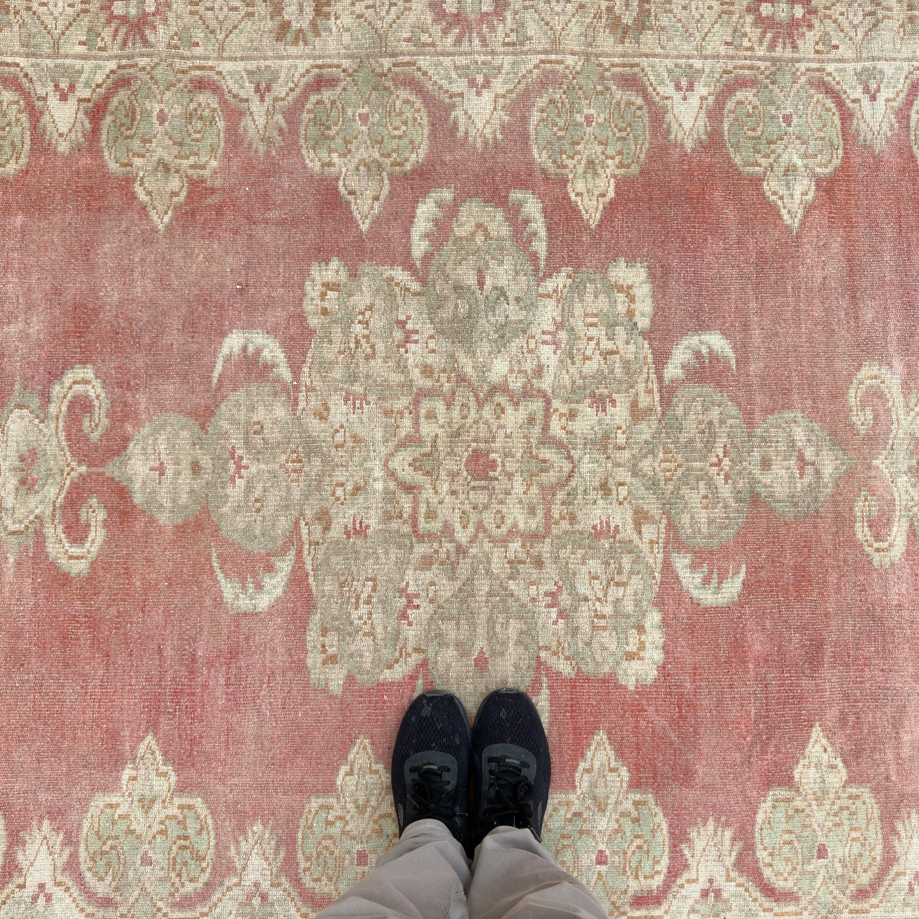 1970s red vintage turkish rug with traditional design, hand-knotted weave and low pile.