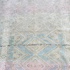 1970s blue vintage turkish rug with geometric design, hand-knotted weave and low pile.