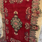1970s red vintage turkish rug with traditional design, hand-knotted weave and low pile.