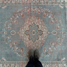 1970s blue vintage turkish rug with medallion design, hand-knotted weave and low pile.