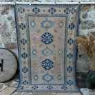Blue 5' x 8' vintage turkish rug with traditional design, handmade in Turkey – Kelton.