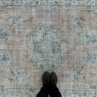 1970s orange vintage turkish rug with medallion design, hand-knotted weave and low pile.